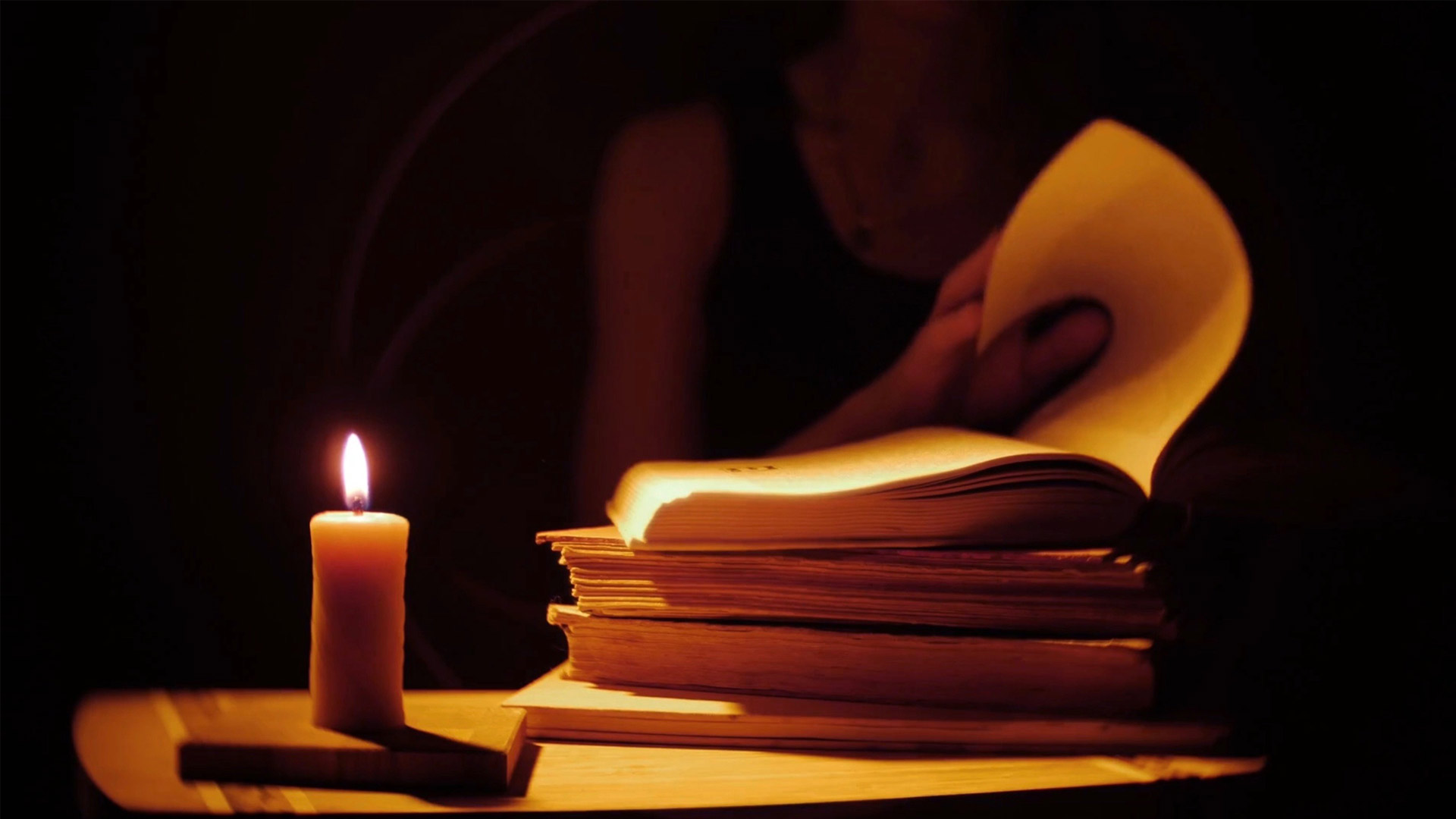 Candle-lit book reading